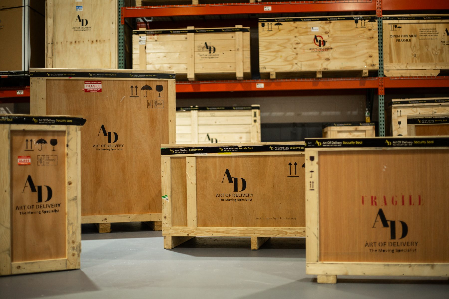 Art of Delivery branded crates in the warehouse